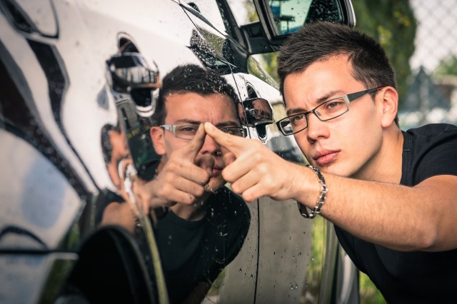 Man looking at used car