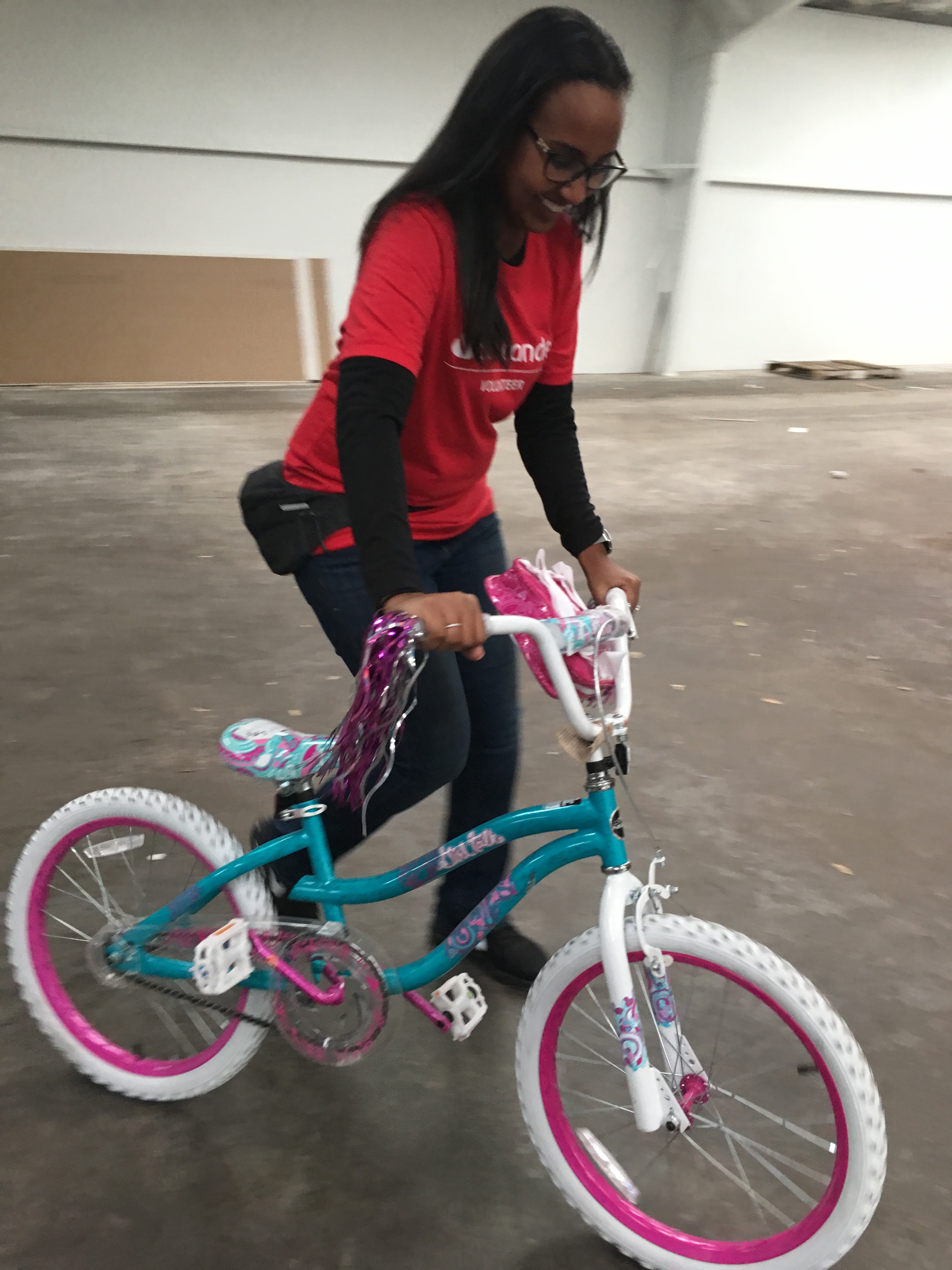 Woman moving bicycle