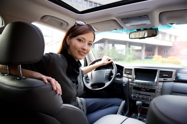 Woman sitting in new car most-popular SUVs