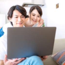 Couple working on a laptop computer