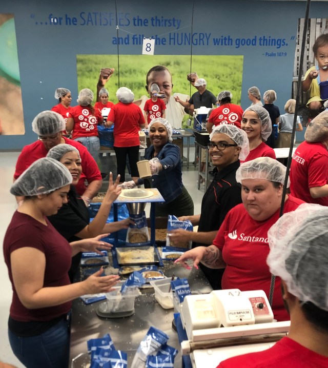 “Starving Children” volunteers in red SC T-shirts