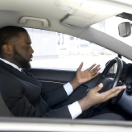 Frustrated man annoyed with bad drivers