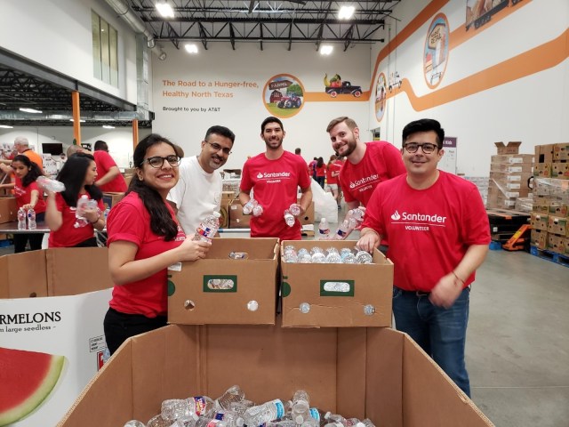 Volunteers filling boxes with water bottles