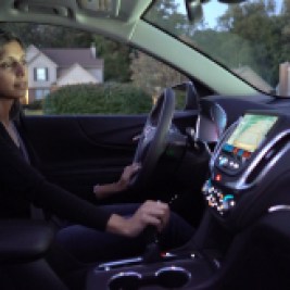 Woman using vehicle safety features