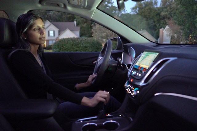 Woman using vehicle safety features