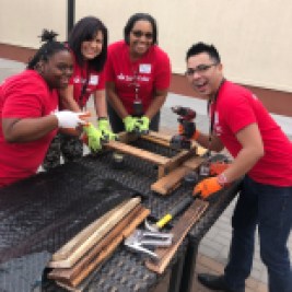 Four SC volunteers working on pallet garden