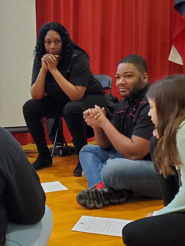 Volunteers sit and listen