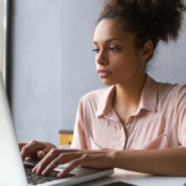 Woman typing on laptop
